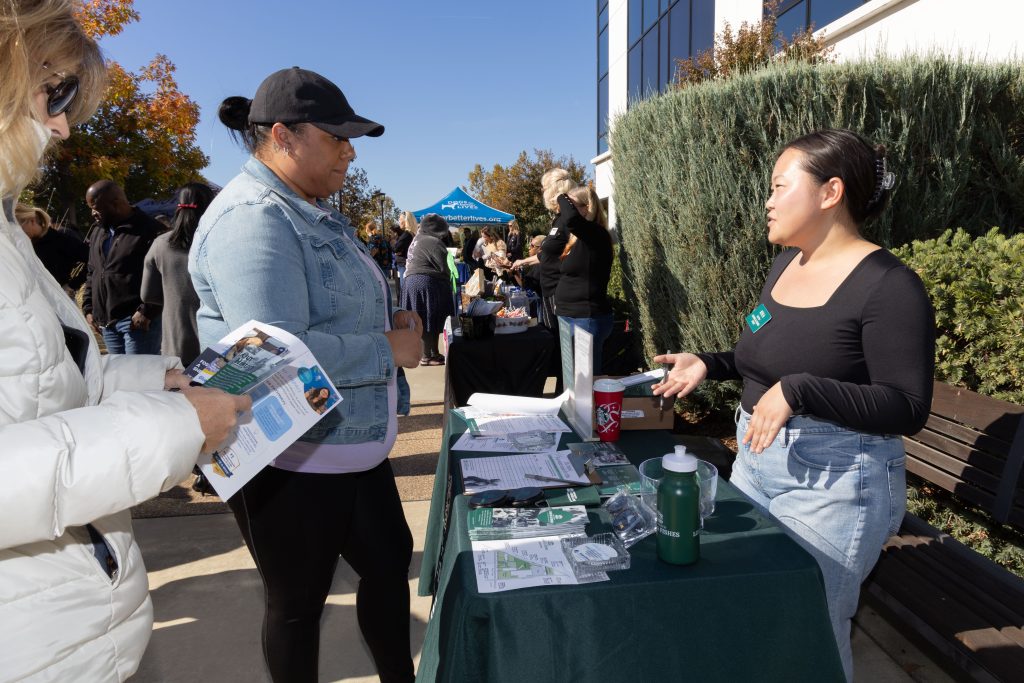 A staff member with Loaves & Fishes at the Our Promise campaign kick-off at headquarters.