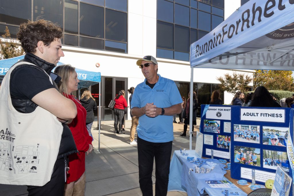 Runnin' for Rhett with the retired founder speaking to people at the Our Promise kick-off event.