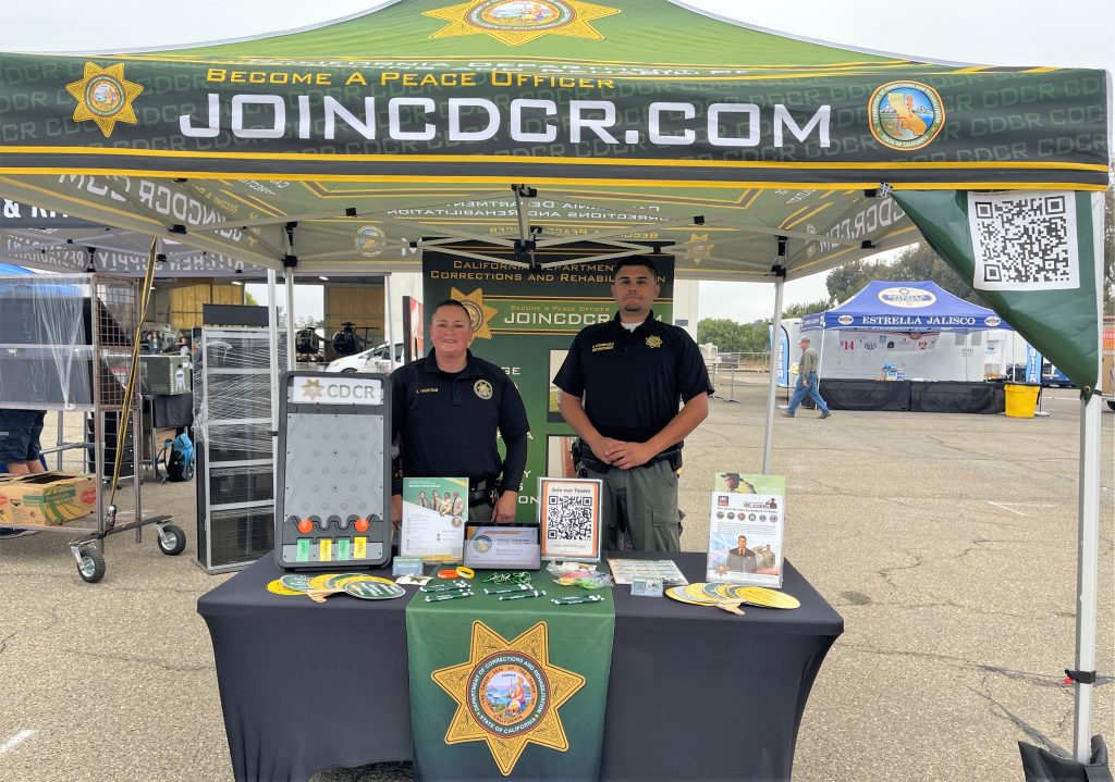 A CDCR recruitment booth at an airshow.