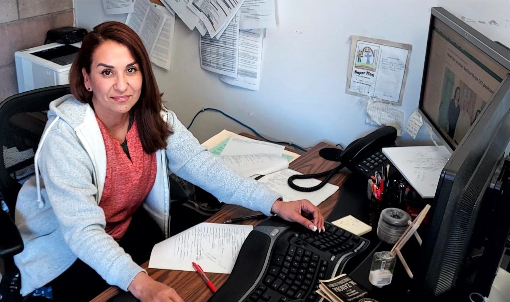 Maria Zamora, correctional counselor, sits at her desk at Central California Women's Facility in Chowchilla.