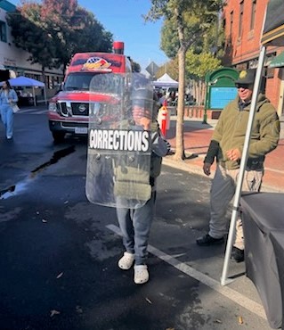 child holding corrections gear