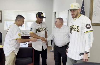 Padres team members meet staff and shake their hands at RJD Correctional Facility in San Diego.