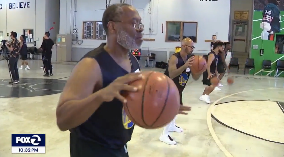 man dribbling basketball