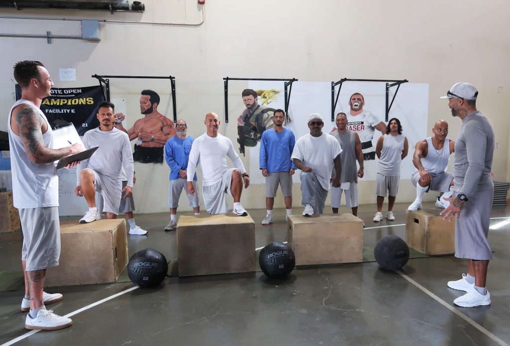 Avenal State Prison participants standing behind 20-inch tall boxes.