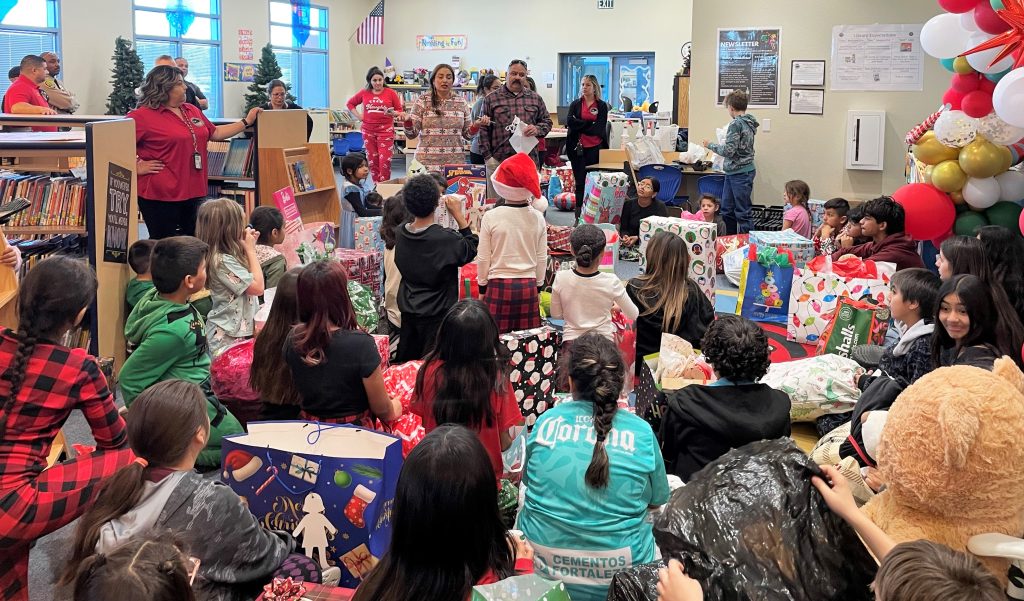 At an elementary school in Blythe, Ironwood State Prison staff volunteer to give gifts.
