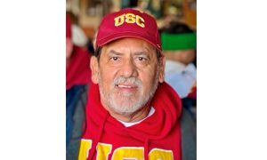 Louis Baltazar, retired captain, wearing USC gear at a game.