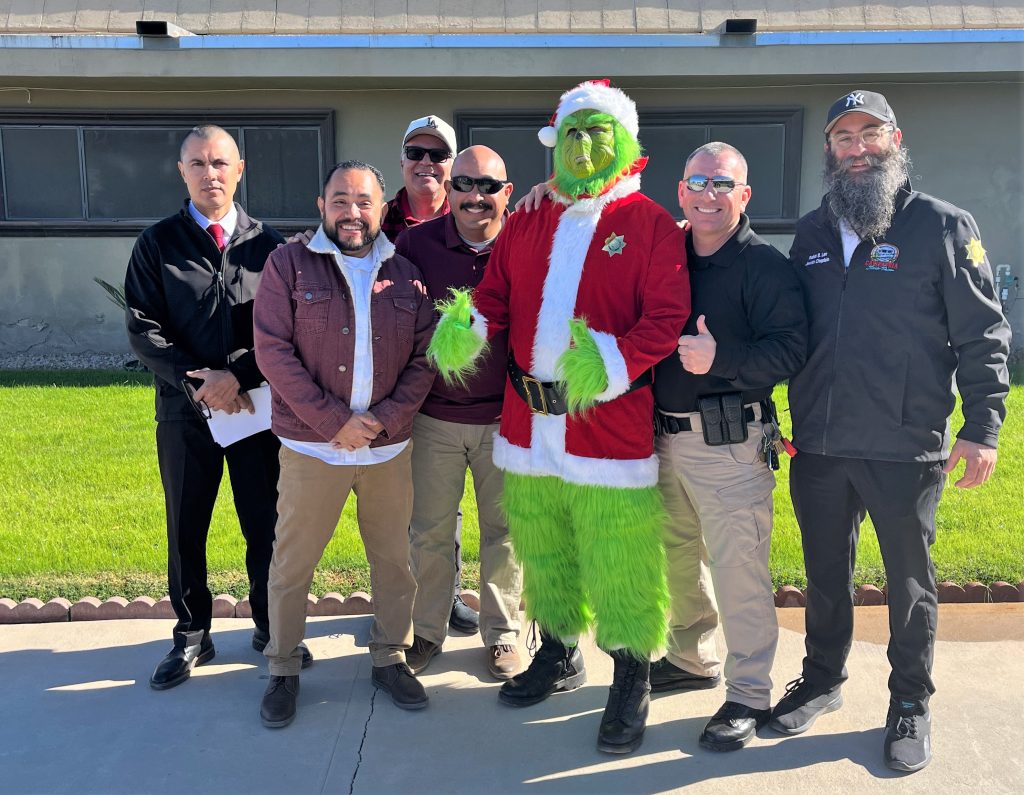 Calipatria State Prison staff with The Grinch.