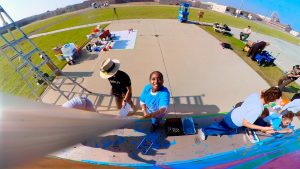 CCWF mural painting with the Healing Through Creative Practice educational program.