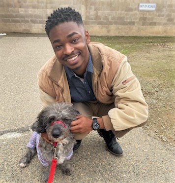 A man with a dog.