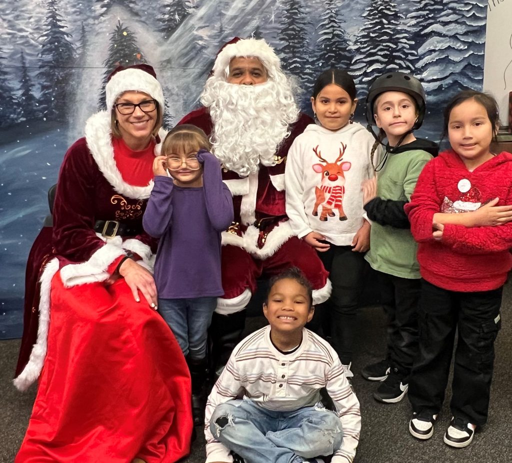Santa and Mrs. Claus with school kids in Stockton.
