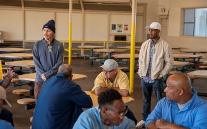 CIM Facility A with Glassman, on the left, and Herd speaking about breaking down barriers and forming bonds.