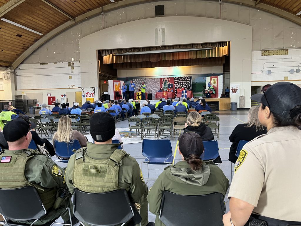 Staff watch the talent show at California Men's Colony.
