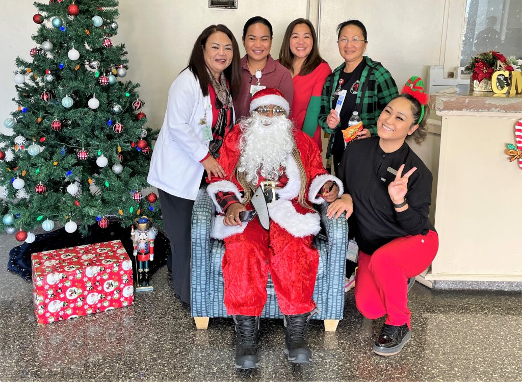 The warden wearing a Santa suit at California Medical Facility in Vacaville.