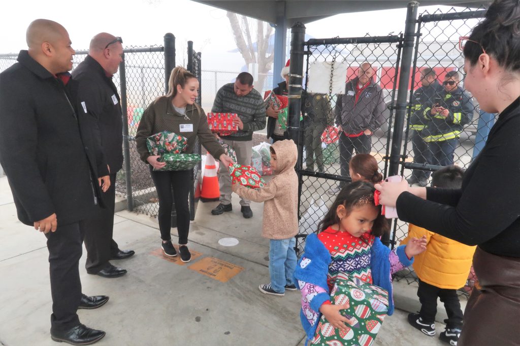 Distributing toys to kids.