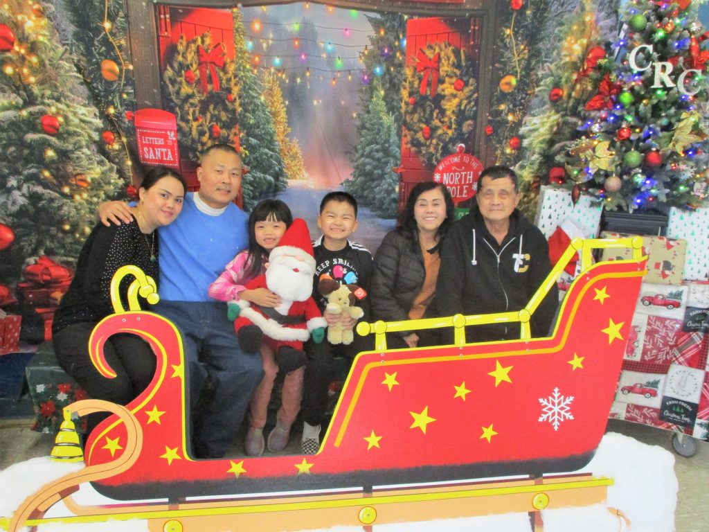 Family posing for holiday photos at CRC-Norco.