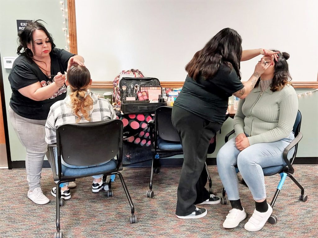 Women's Empowerment meeting with parole supervised women having their makeup done.