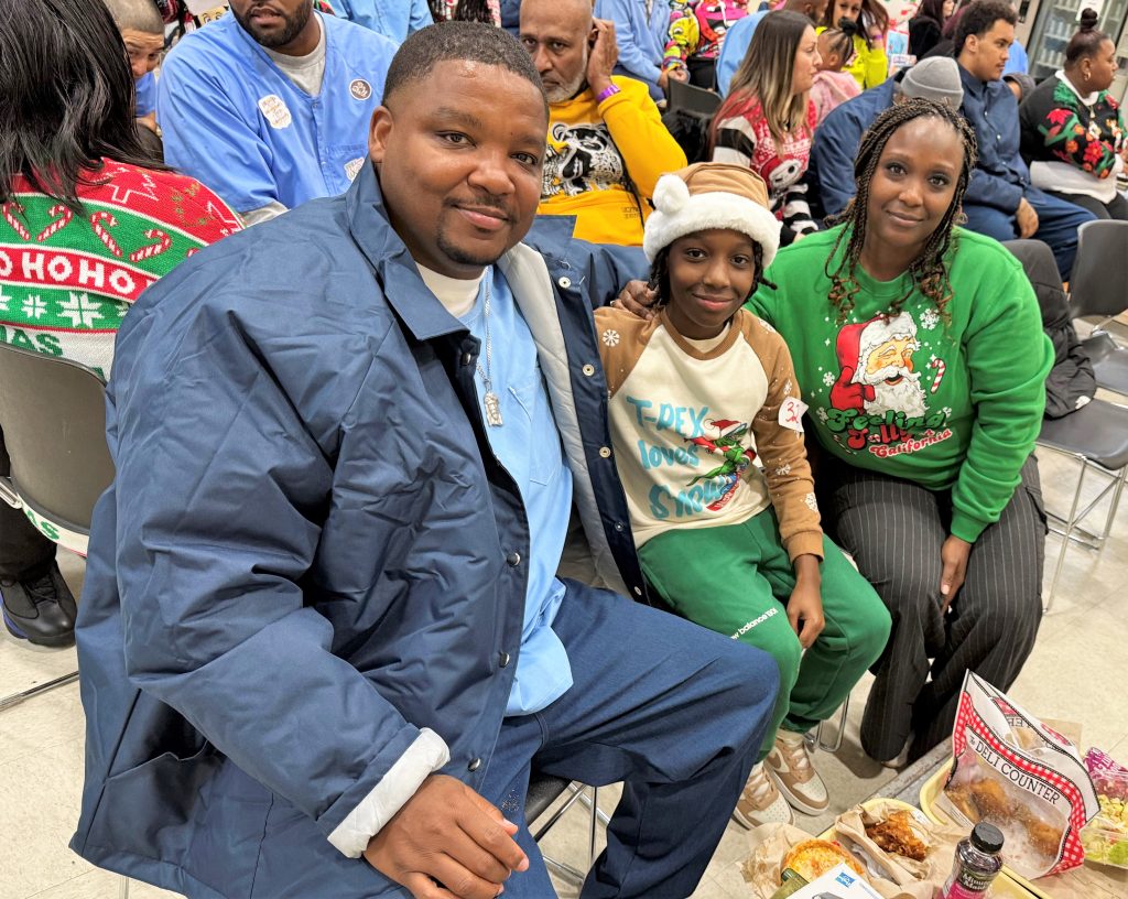 Incarcerated person with his family at Folsom State Prison. 