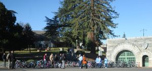 A news crew, incarcerated people, prison staff and refurbished bicycles.