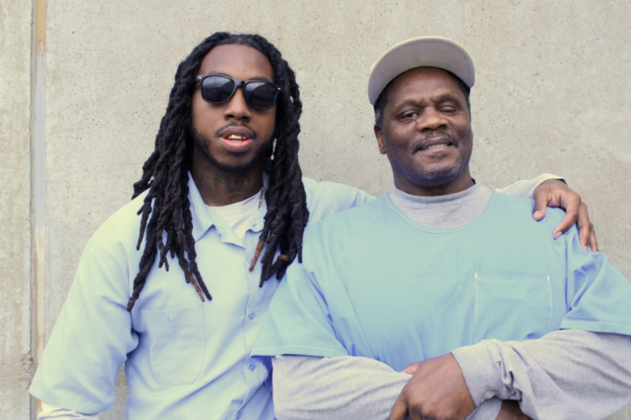 two incarcerated people posing for photo together