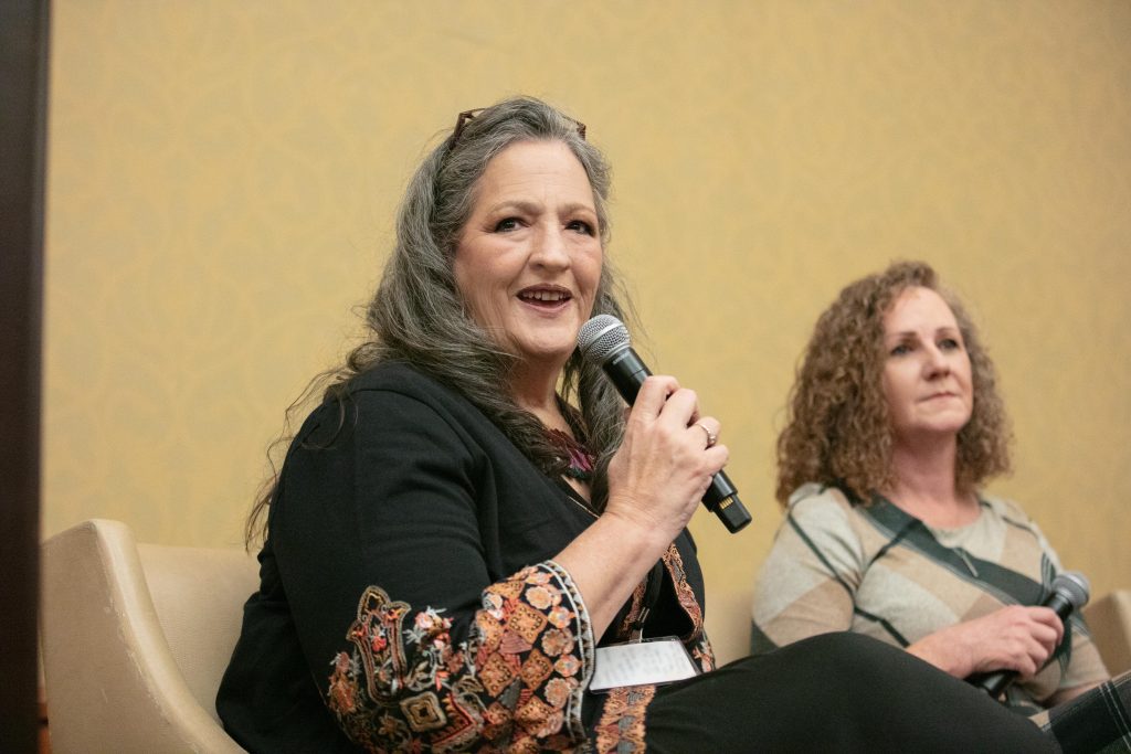 Superintendent Shannon Swain speaks into a microphone.