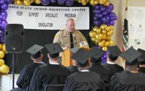 PSSP graduation at WSP-RC with a uniformed staff member speaking to the graduates.