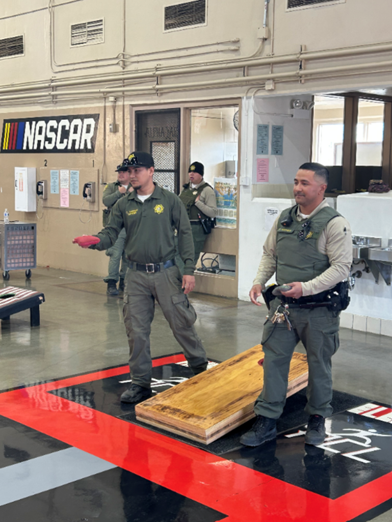 ASP staff playing cornhole 
