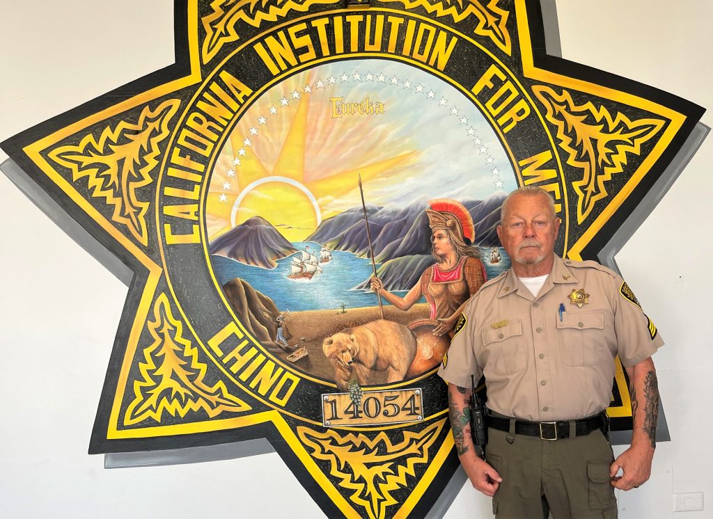 John Bennett with the CIM log in the lobby.