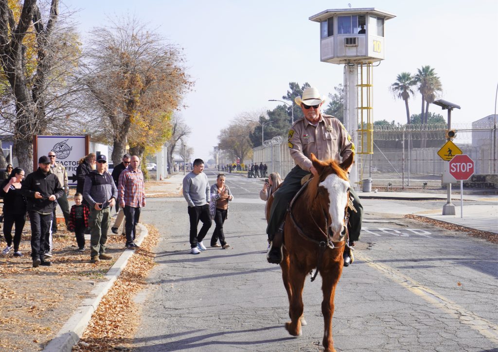 Bennett rides out of CIM on horseback.
