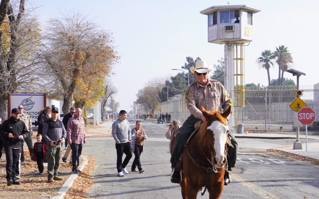Bennett rides out of CIM on horseback.