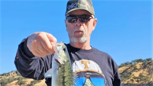 Craig Butts holding a fish.