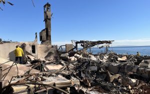 Strike team members from CDCR search through the rubble in the Palisades, searching for hotspots while helping survivors.