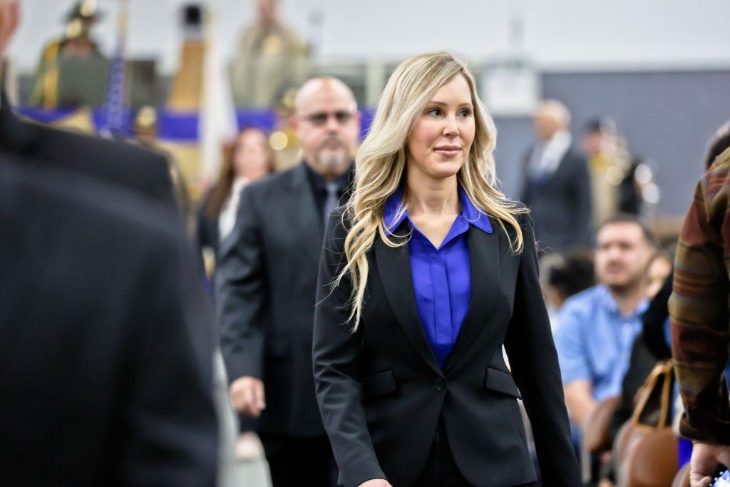 New parole agent cadets enter the academy graduation.