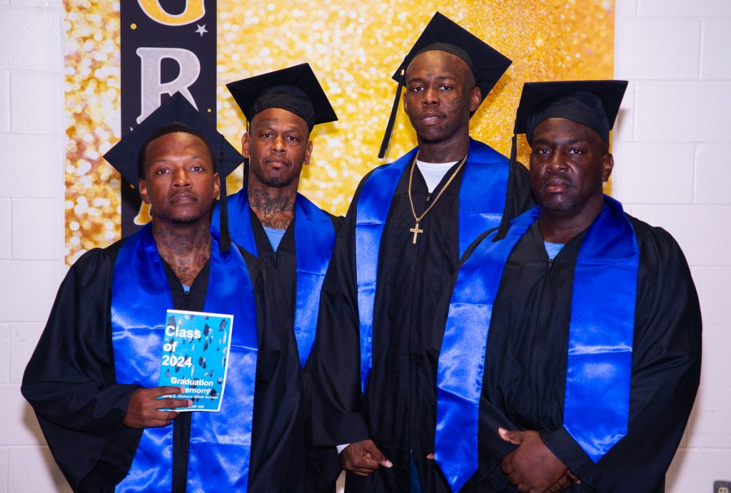 Graduates pose for a photo at North Kern State Prison.