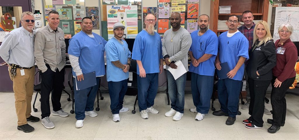 Educators and OCE essay writing contest winners at Folsom State Prison.