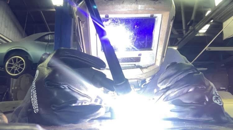 Tig welding with sparks flying.