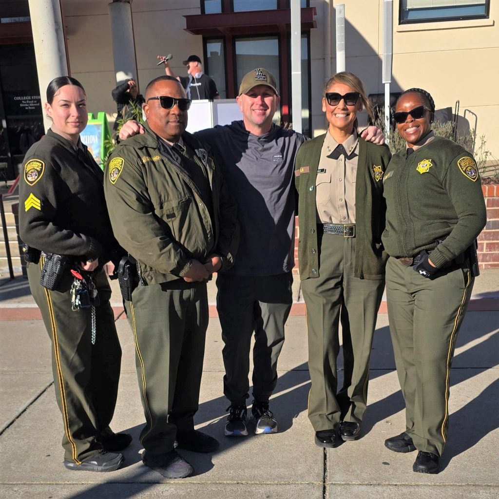 A group photo of five CDCR staff members at the Martin Luther King Day march.