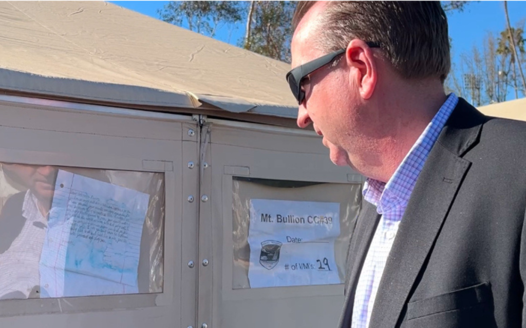 The CDCR secretary looks at a letter thanking incarcerated fire crews with helping during the Los Angeles fires.