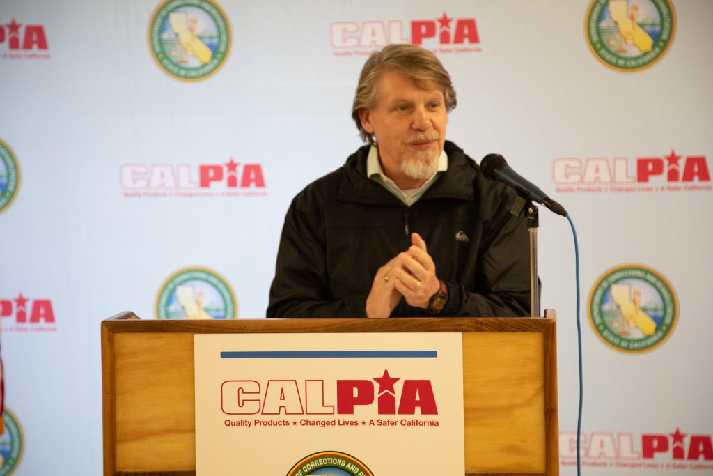 CALPIA General Manager Bill Davidson speaking at a graduation ceremony.