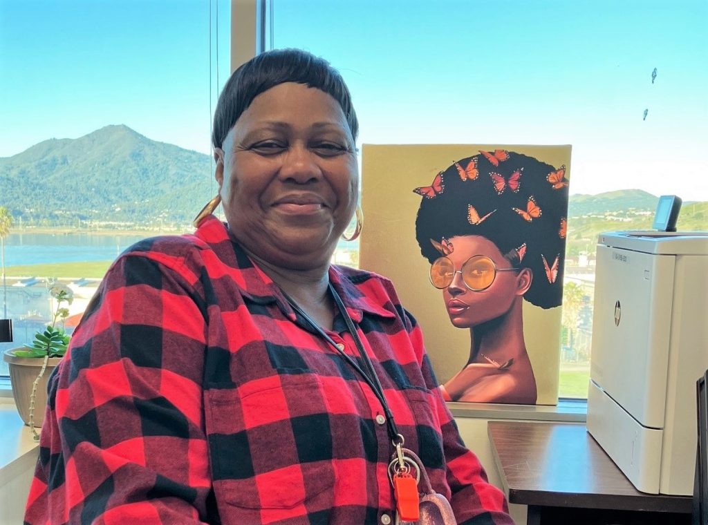 Beverly Allison organizes a Black History Month potluck to explore the culture through food. She's sitting in her San Quentin Rehabilitation Center office, overlooking the water.