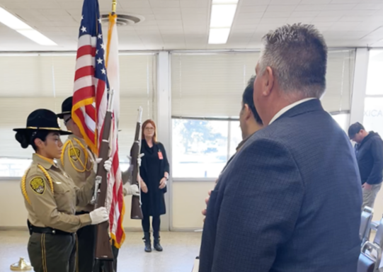 Honor guard at CCI with warden standing.