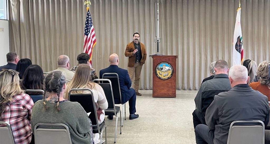 Associate Warden Miguel Garcia speaks during promotional ceremony at CCI.
