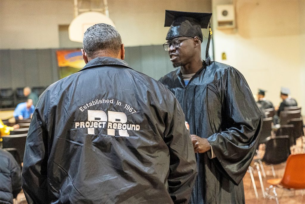 Project Rebound founder with an incarcerated graduate. 