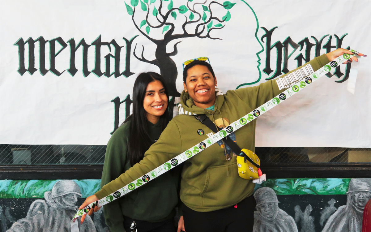 California State Prison, Corcoran, staff hold a ribbon of stickers at the institution's first mental health awareness day event.