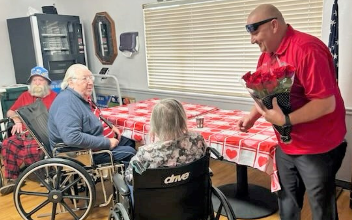 ISP staff give Valentine's Day gifts to residents of a nursing facility in Blythe.