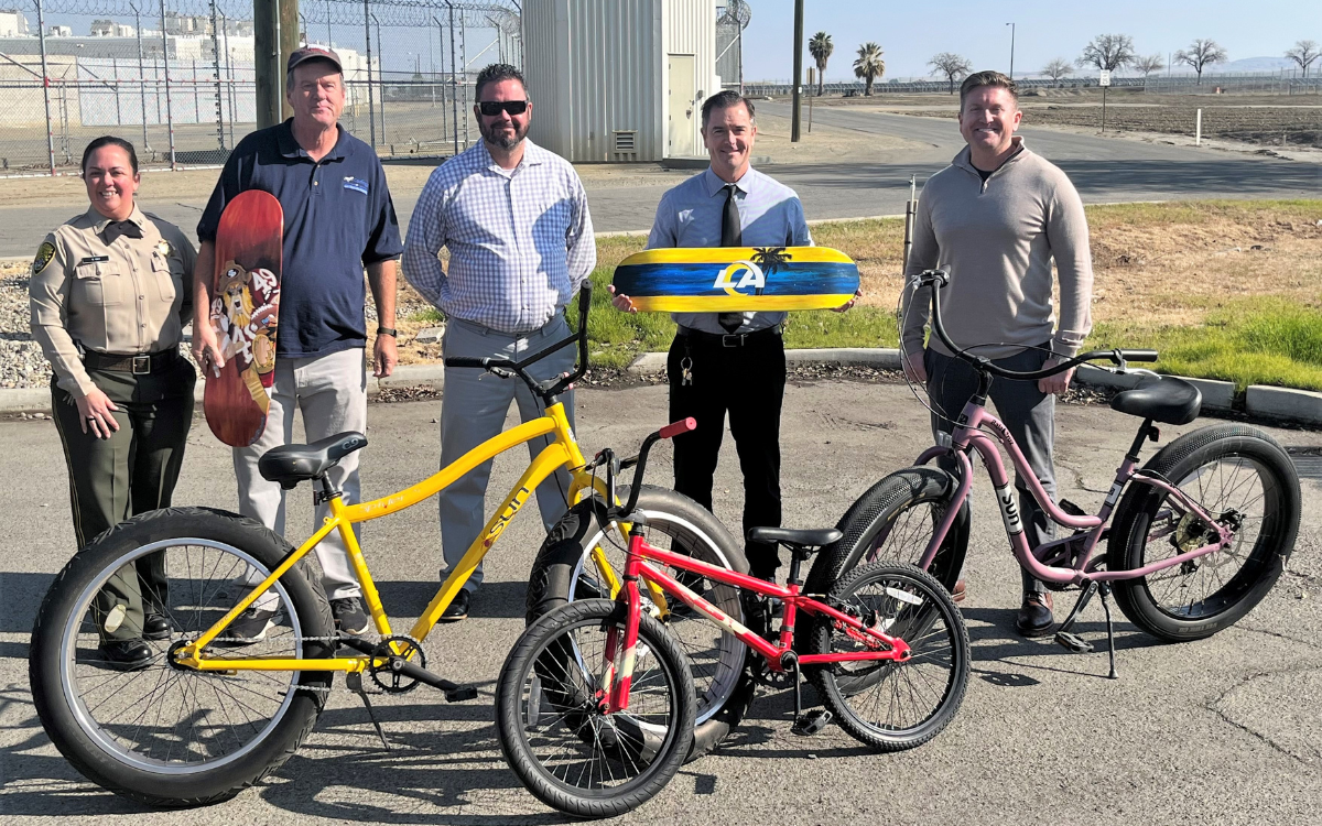 Community benefit from PVSP staff to Coalinga Chamber of Commerce with bikes and skateboard decks.