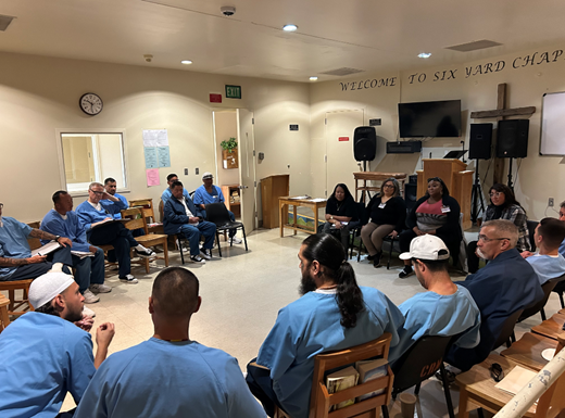 Ten Toes In Workshop group of incarcerated individuals and staff leading workshop 