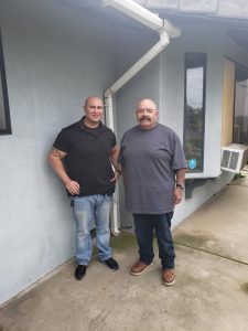 Two people at a Male Community Reentry Program facility.