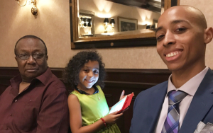 Joshua Holmes basketball classic honors legacy of a young man who died from cancer. Photo shows Holmes with his father and daughter.