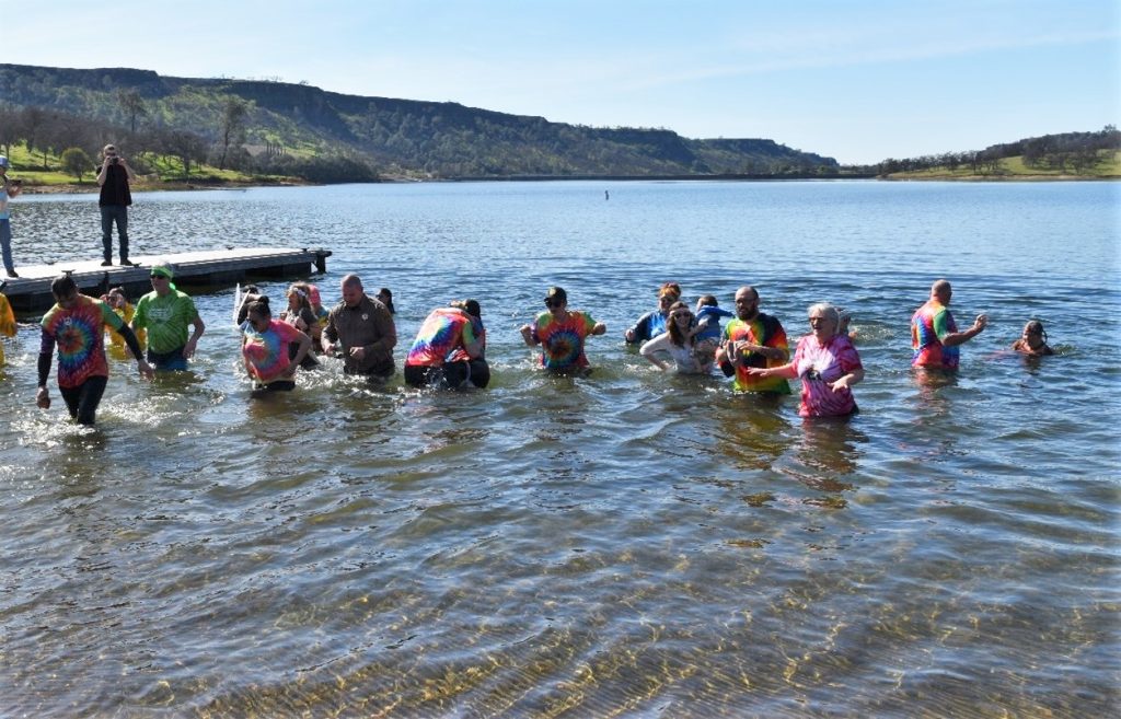 Sierra Conservation Center staff in the waters of Tulloch Lake for the Polar Plunge.