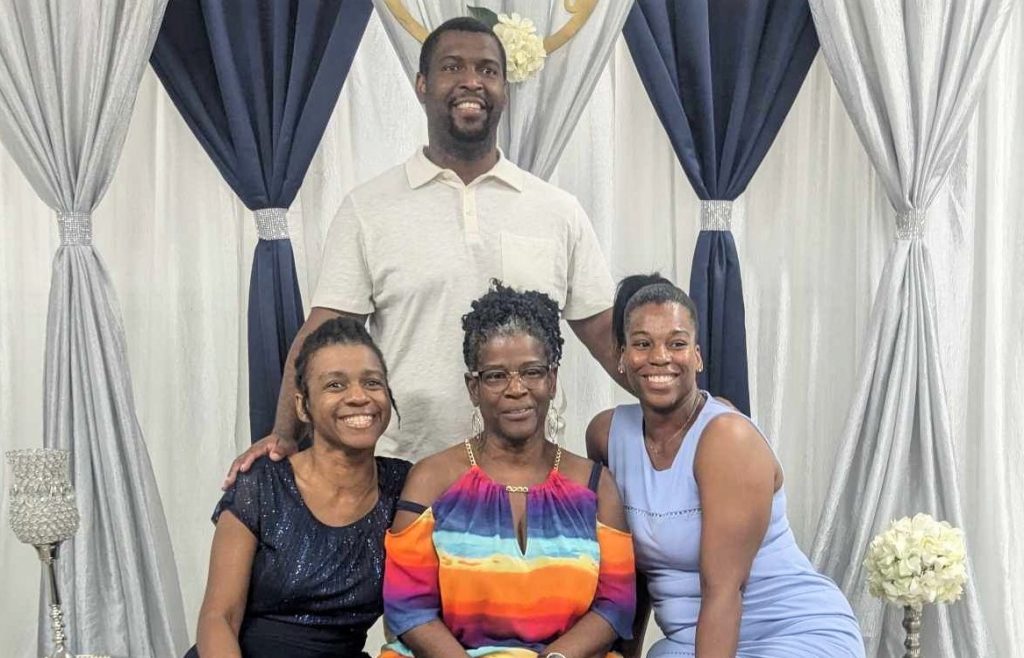 The Walker family help with the Joshua Holmes basketball classic fundraiser. The mom and her three children.